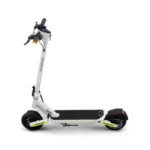 Electric scooter with a white/gray frame, black handlebars, front headlight on, and neon yellow accents on the base and wheels.