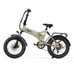 Beige compact folding electric bicycle with fat tires, front suspension, rear rack, kickstand, and mid-motor drivetrain