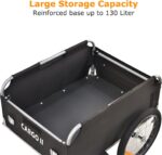 Open black cargo wagon with metal frame and large interior space; 'CARGO' label on the side and big wheels visible outside.