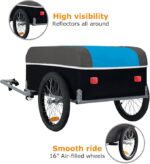 Towable trailer with a blue and gray cover, high-visibility reflectors around the sides, and 16-inch air-filled wheels for a smooth ride.