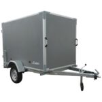 Gray enclosed cargo trailer on a single-axle chassis with a tow hitch and jockey wheel, ready to tow.