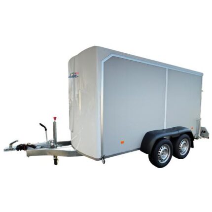 Enclosed dual-axle cargo trailer with a tow hitch for towing and dual wheels on each side